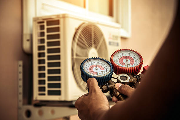Professional Air Conditioning Service technician working in Normal, AL